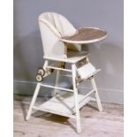 A child's vintage high chair with rexine padded tub back chair and kidney shaped tray which converts
