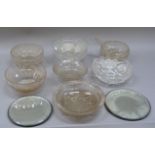 A quantity of decorative cut glass bowls and mirror stands