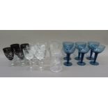 A set of six blue glasses etched with swirling bands, together with various cut and other table ware