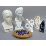 A quantity of decorative ceramics including, a reproduction Phrenology head, a 'Lifeline' hand,