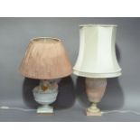 Two pottery table lamps, one floral encrusted, the other moulded with trefoil and foliate borders,