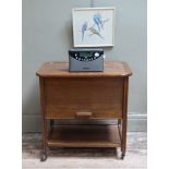 A 1930s work trolley with lift up lid and drawer, embroidery of budgerigars framed, Roberts radio