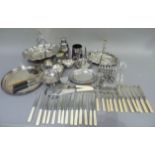 A collection of silver plated items including, two cake baskets, sugar and cream, cocktail shaker,