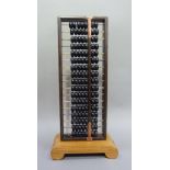 A Chinese ebony and hardwood abacus