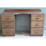 A mahogany dressing table with three drawers to either side