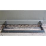 A late 19th/early 20th century steel fire kerb of pierced decoration, together with another with
