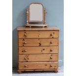 A five drawer pine chest of five drawers with turned handles and feet together with a pine toilet