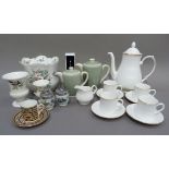 A Royal Worcester Strathmore coffee pot, cream, four coffee cans and saucers, together with a