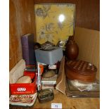 A box with solitaire board top, silver plated teapot, glass ship, lighter, yo-yo, printed tin,