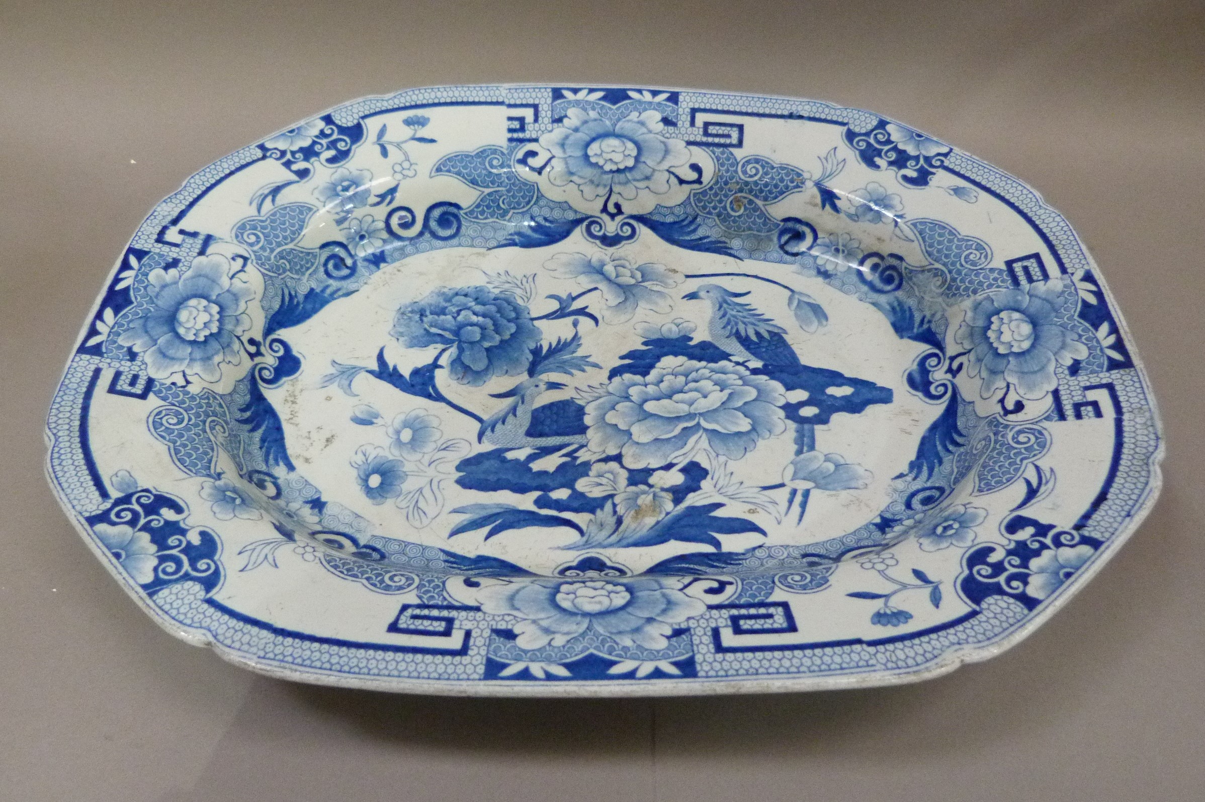 A 19th century patent Ironstone china meat plate printed in blue and white with a pattern of