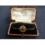 A lady's manual wristwatch c.1937 in 9ct gold Biseau case, circular silvered and engine turned