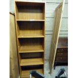 A teak veneered open bookcase