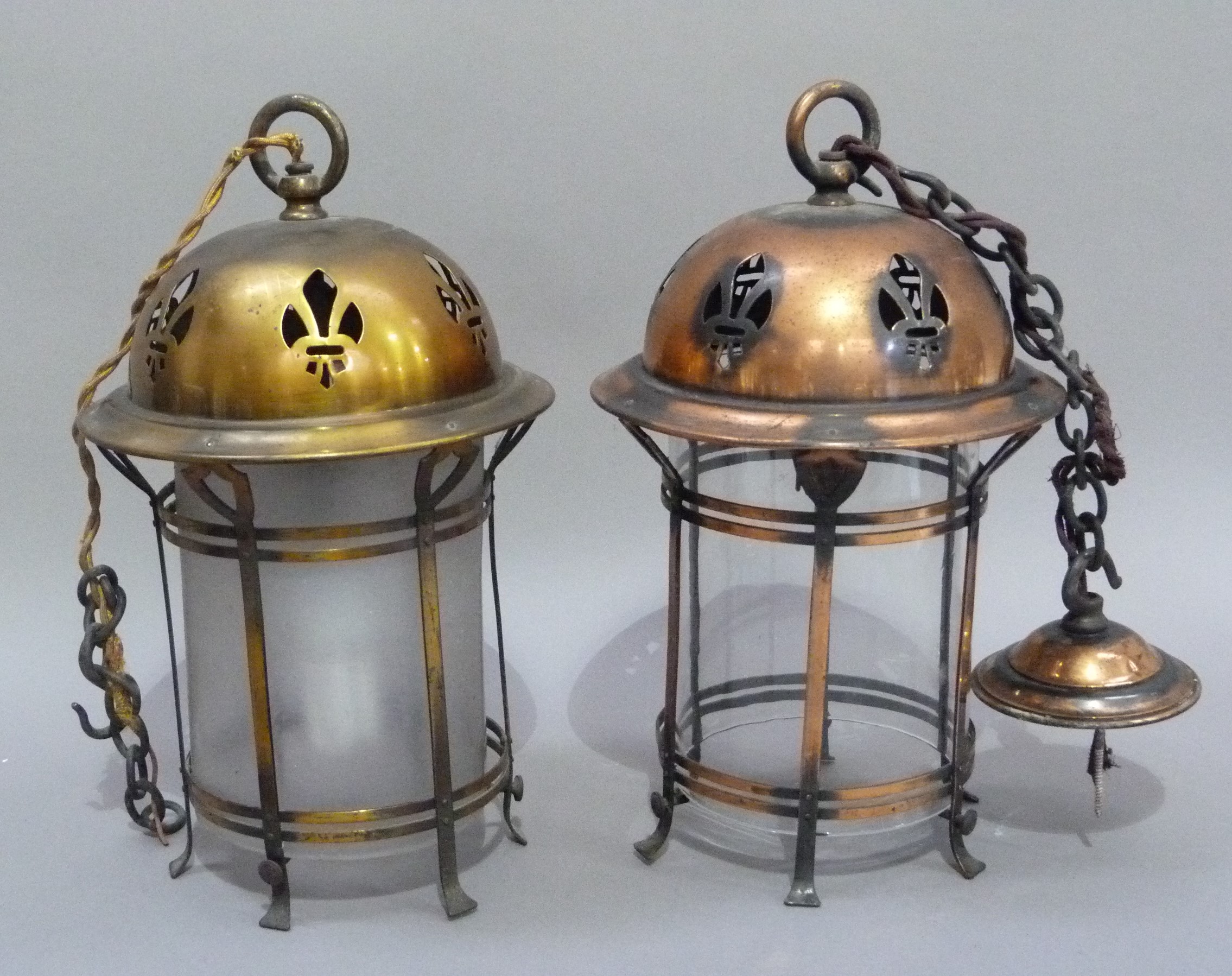 A early 20th century brass and opaque glass hall lantern the domed top with pierced decoration,