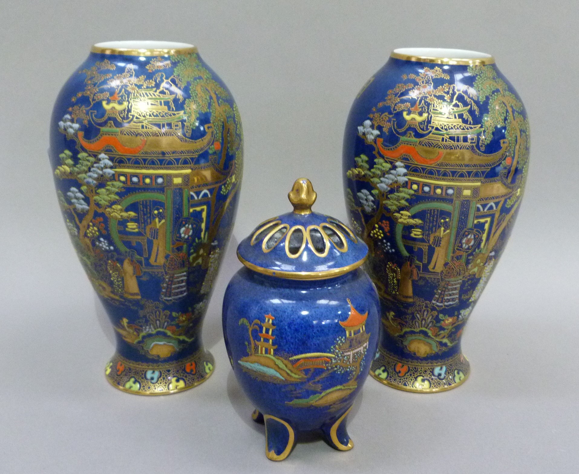 A pair of Carlton ware baluster vases printed in gilt and enamelled on a blue ground with a - Image 3 of 3