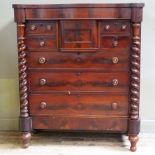 A 19th century mahogany Scottish chest, serpentine outline having a deep drawer to the centre