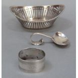 A foreign silver sweet meat basket of pierced boat shape design, a silver napkin ring 1929, a silver