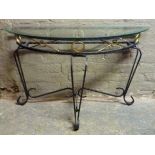 A metal and glass semi-circular console table