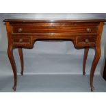 A rosewood console table fitted with one long and two short drawers on