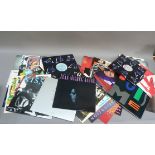 A record case with LPs and singles, mainly 1980s/90s pop music to include Sly & Robbie, S & S