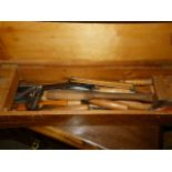 A vintage tool chest containing, various size saws, drill and bit, level, together with a pine box