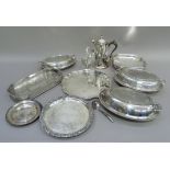 A silver plated coffee pot of 18th century design, three oval entreé dishes and covers, cake basket,