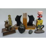 A pair of Art Deco scotty dog book ends, together with a Bavarian carved wood bear with shoes sat