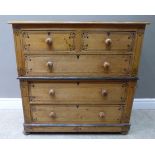 A Victorian pine chest stenciled with stylised foliage and line decoration, having two short and