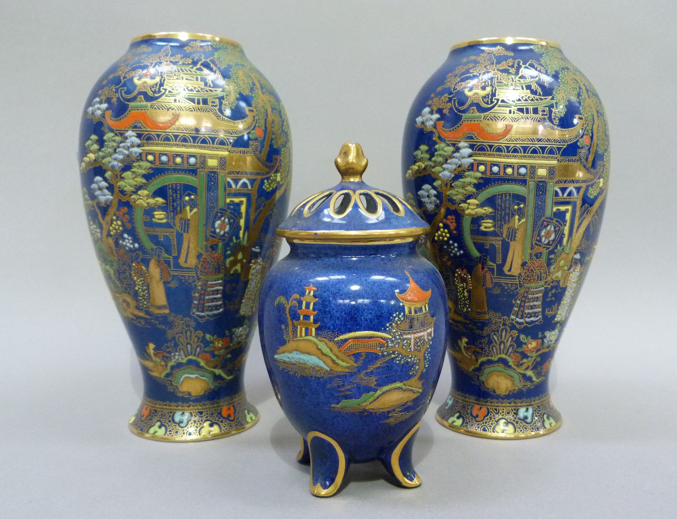 A pair of Carlton ware baluster vases printed in gilt and enamelled on a blue ground with a - Image 2 of 3