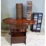 A quatrefoil faux wood coffee table, magazine table and rack, a four drawer leather and rush tower