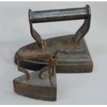 A William Roberts & Co flat iron together with a Newman? box iron with wooden handle (2)