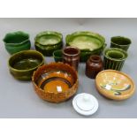 A collection of turn of the century art pottery and later ceramics including, two Bretby green glaze