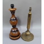 A brass columnar table lamp; together with a reproduction wooden baluster table lamp, 50cm high