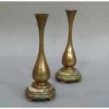 A pair of French bronze baluster vases with waisted necks, foliate engraved on marble spreading
