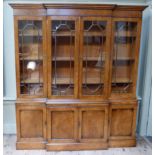 A reproduction pollard oak veneered breakfront bookcase with flared cornice the upper section