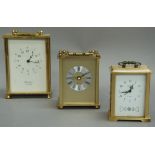 Three brass cased carriage clocks, one by Woodford, another German quartz movement example, an