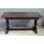 A reproduction oak refectory coffee table in late 17th century style, the rectangular top above a