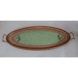 An Edwardian Art Nouveau oval two handled mahogany tray, the centre with beadwork Art Nouveau panel,