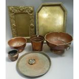 Brass and copper ware including trays, planters, punch bowl with lion mask and ring handles, stepped