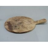 Robert Thompson - a mouseman breadboard carved with signature mouse, 39cm long (a/f)