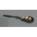 A late Victorian silver spoon with pear shaped bowl, the stem with Apostle terminal scroll and