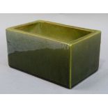 A Bretby green glazed pottery rectangular jardiniere, 19cm wide x 10cm high, impressed marks