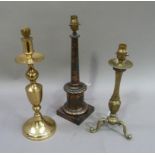 Three table lamps, one of brass baluster form, another copper lacquered columnar and another with