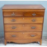 A Victorian mahogany chest of two short and three long graduated drawers outlined with parquetry