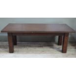 A reproduction mahogany coffee table, rectangular top above square legs, top 120cm x 60cm