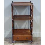 A mahogany three tier etagere the rectangular top with three quarter gallery above shelf and