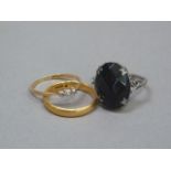 A wedding ring in 22ct gold, approximate weight 3gm, together with a three stone diamond ring in