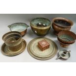 A quantity of brass and copper ware including, large bowls, chamber stick, trays, etc