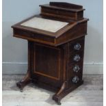 An Edwardian Sheraton revival mahogany Davenport with superstructure sloping writing surface inset