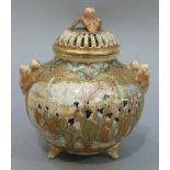 A Japanese Satsuma pot pourri vase and cover with bud finial and handles to the shoulders, the