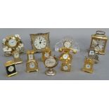 A small quantity of brass, glass and other small and miniature quartz timepieces